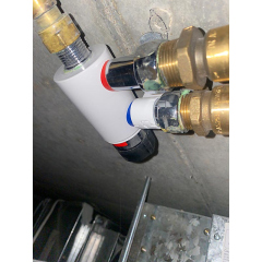 A leaking thermostatic mixing valve in the ceiling space at a strata complex in  Griffith Canberra