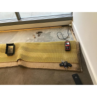 Water damaged carpet and quick edge caused by a leaking door frame in Deakin Canberra