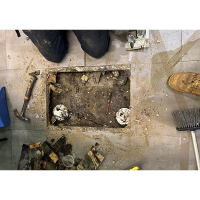 Rotting timber and vinyl floor in a Canberra restaurant - Caused by a blocked drain and a sewer pipe cap that was not sealed